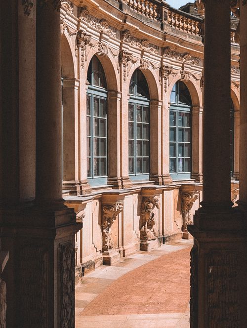 Free Beautiful baroque architecture in the Zwinger Palace, Dresden, capturing elaborate stone arches and sculptures. Stock Photo
