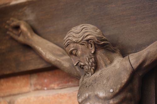 Free Detailed shot of a wooden crucifix highlighting craftsmanship. Stock Photo