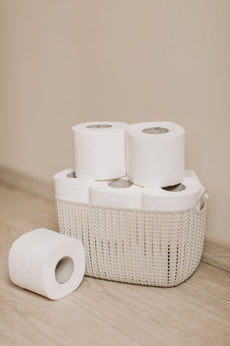 White Tissue Paper Roll On White Wicker Basket