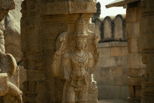 Detailed stone sculpture depicting Hindu mythology at Lepakshi Temple, Andhra Pradesh.