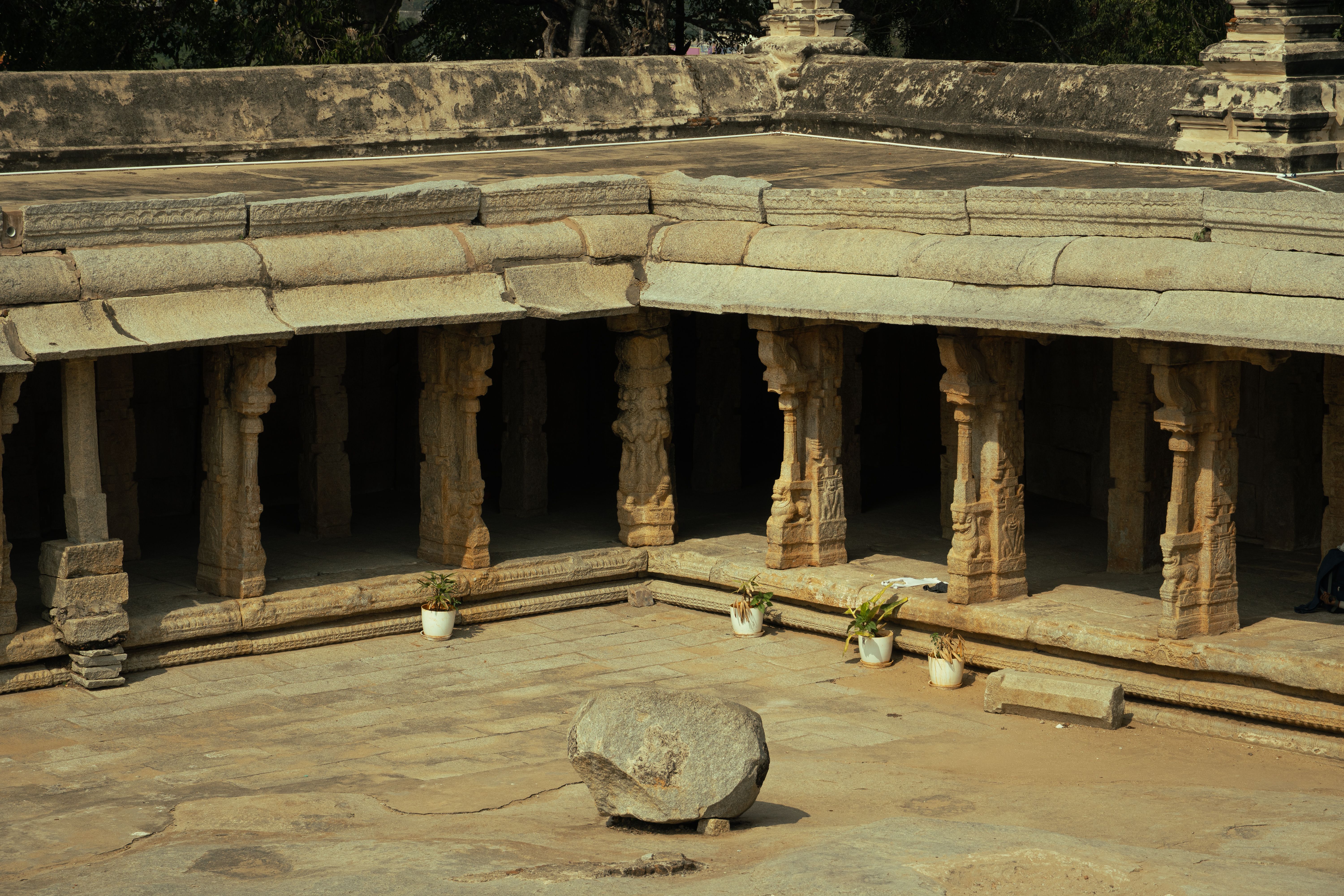 Historic temple architecture in Lepakshi, Andhra Pradesh featuring ancient stone columns.