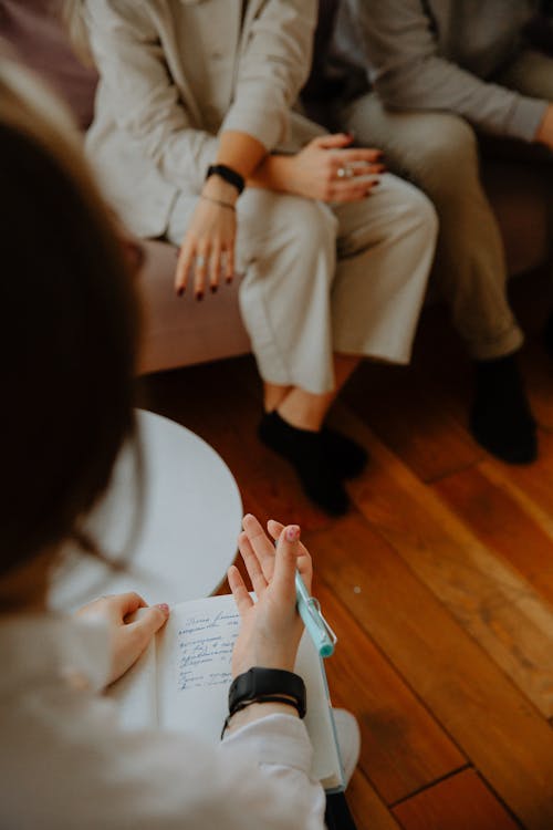 Free Therapist Giving Advice to Couple Stock Photo