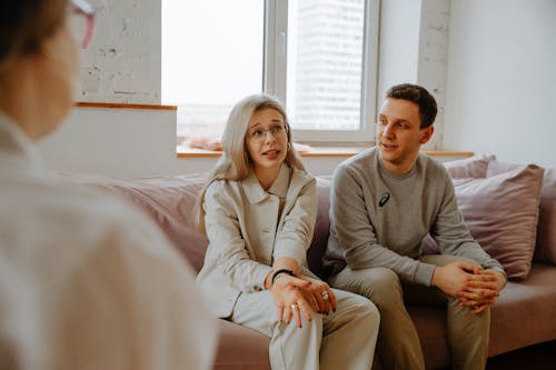 Free Couple Talking with Therapist Stock Photo