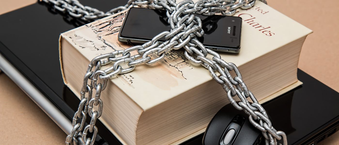 Digital padlock over network diagram representing a cybersecurity firewall breach affecting Montreal businesses.