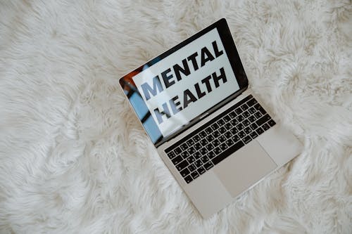 The Words Mental Health on Laptop Screen