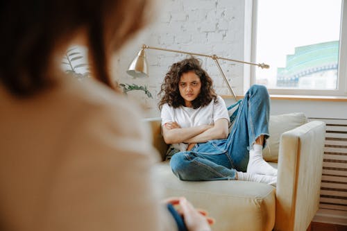 Upset Woman Listening to Therapist