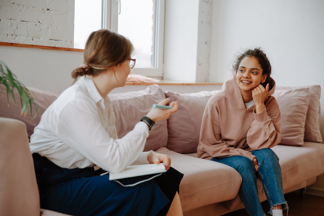 Free Young Woman Talking with Therapist Stock Photo