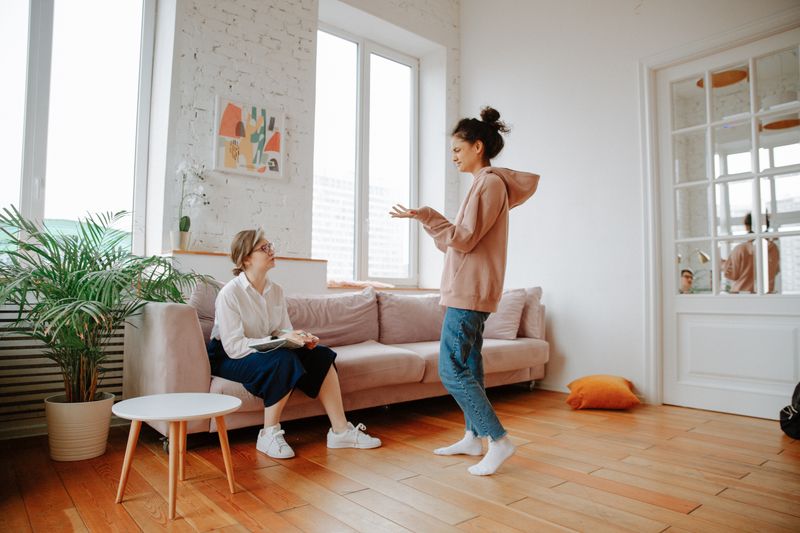 An adult in a relaxed, supportive counseling conversation