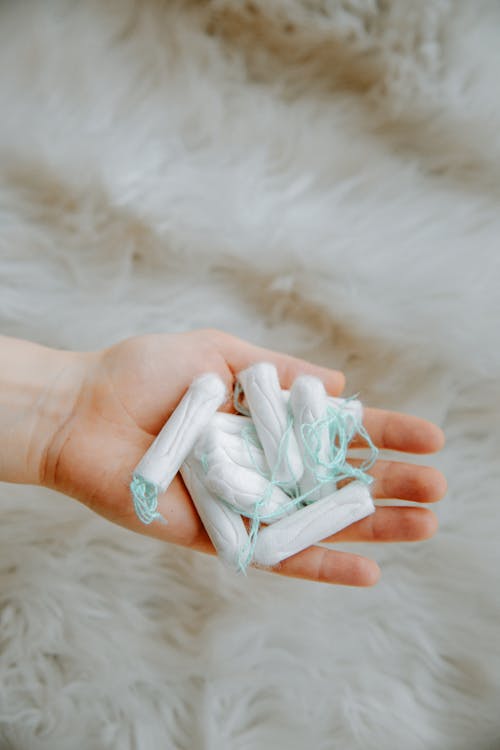 Woman Holding Tampons