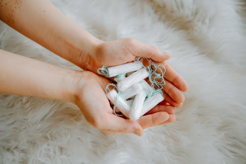 Free Person Holding Tampons Stock Photo