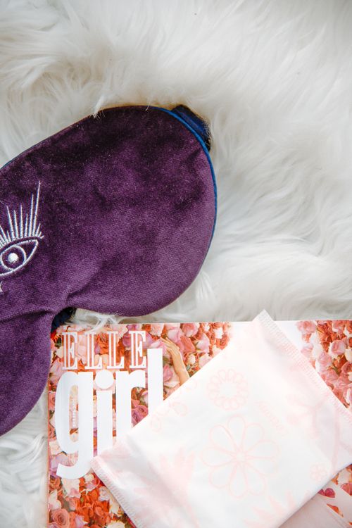 Free Aesthetic arrangement of menstrual pad and sleep mask on fluffy surface for feminine hygiene Stock Photo