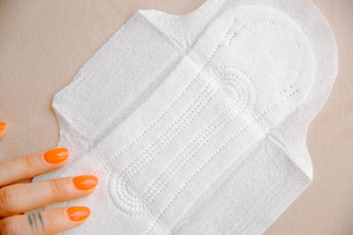 Woman Touching Sanitary Pad