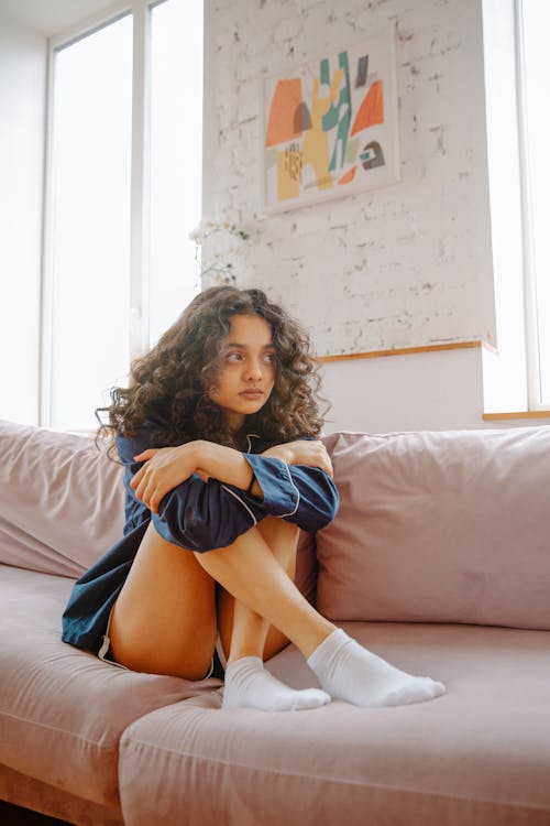 Woman Sitting on Couch