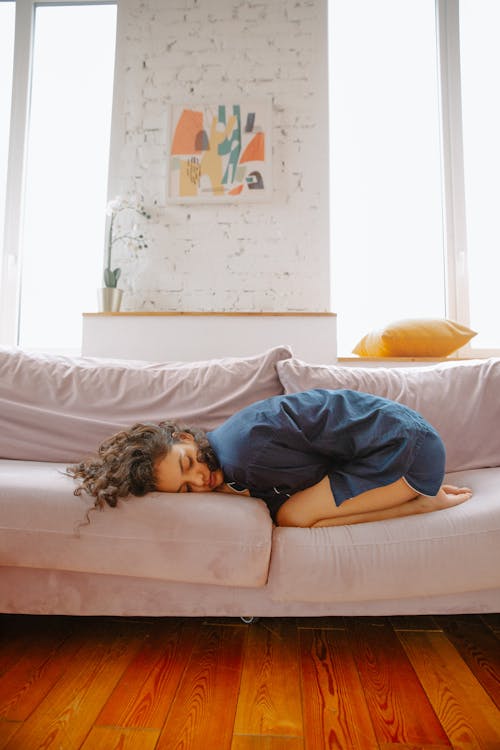 Woman Lying on Couch