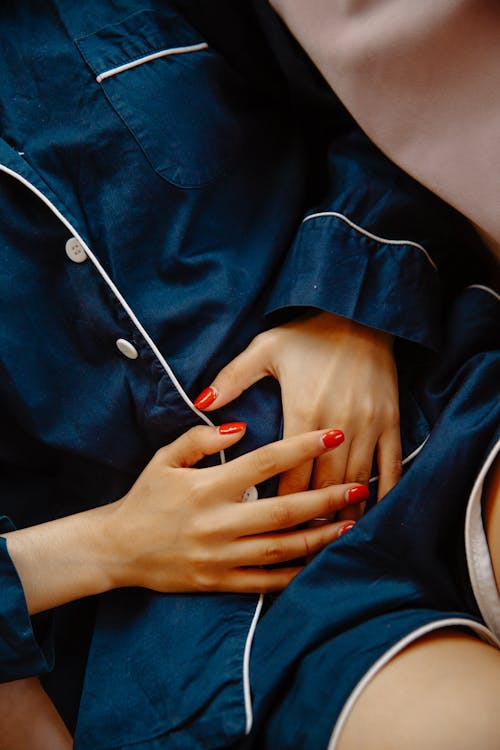 Close-Up Photo of Woman Touching Her Abdomen