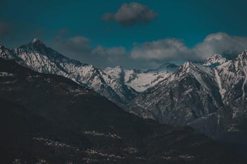 Snow Covered Mountains Under Blue Sky