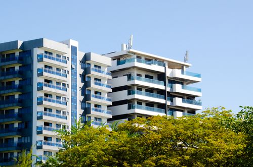 Free High-rise modern apartment buildings with clear sky, showcasing urban architecture. Stock Photo