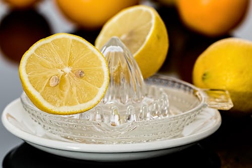 Yellow Lemonade on Clear Glass Saucer