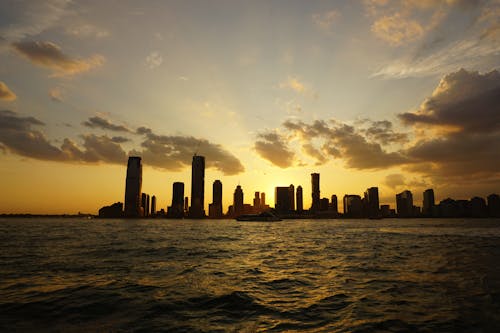 Silhouette Of City Buildings During Sunset