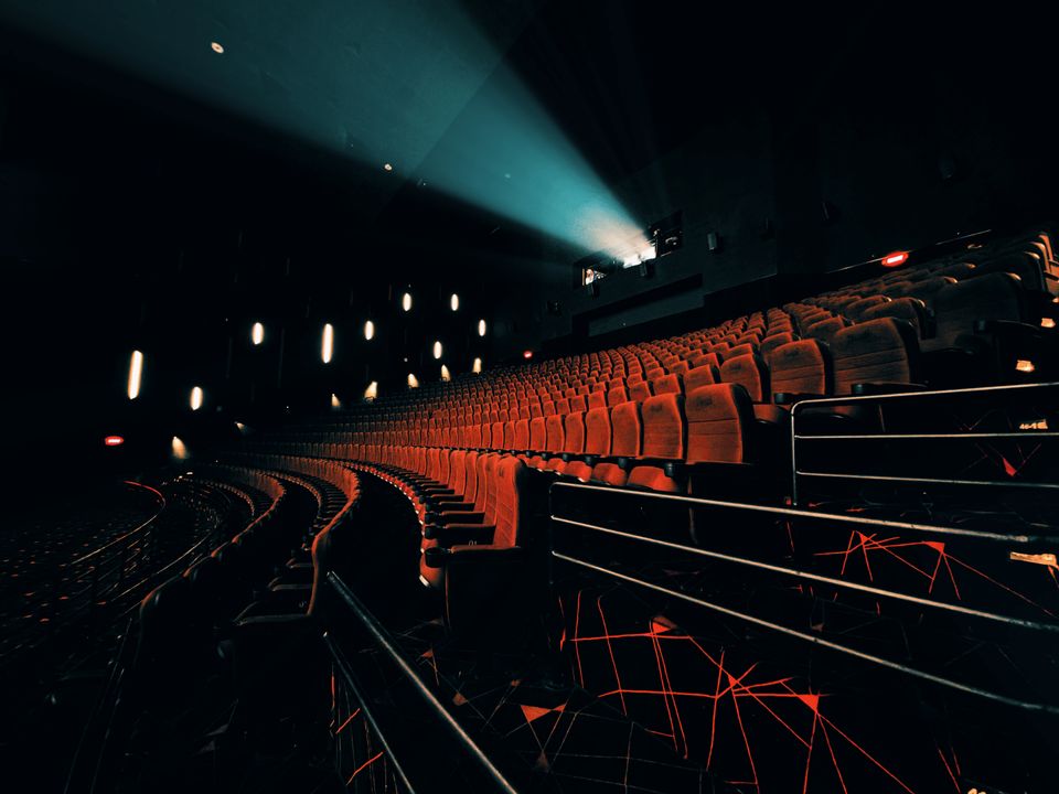 Dark cinema with projector beam