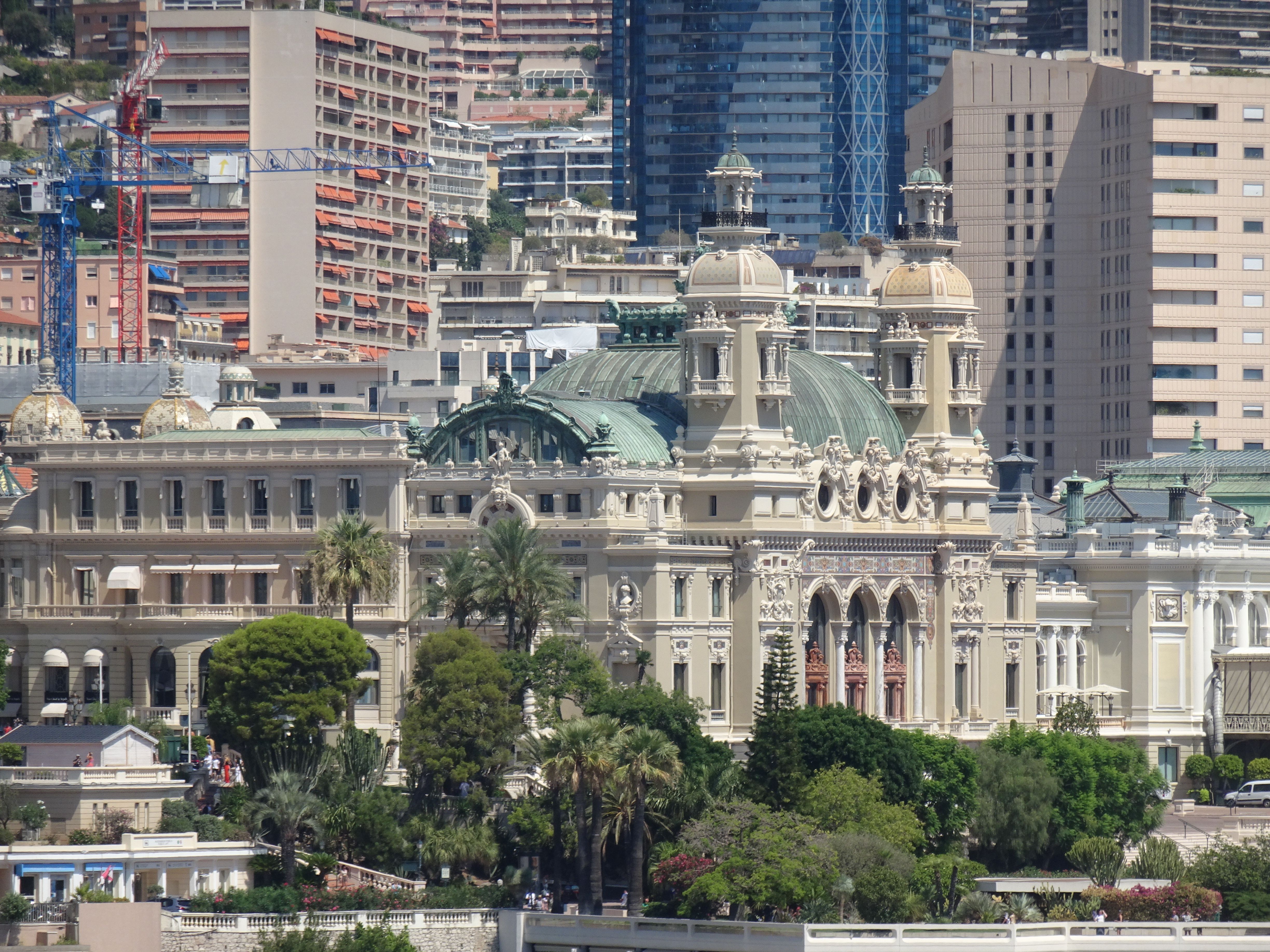 Monte Carlo Casino exterior at dusk, illuminated Belle Époque architecture overlooking Monaco’s busy Place du Casino