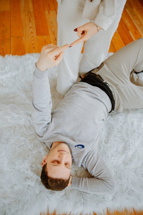 Free Man Lying Down on Fur Carpet Stock Photo