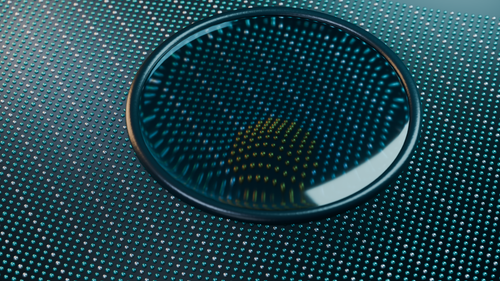 Free Close-up of a glass lens reflecting light on a high-tech metallic surface Stock Photo