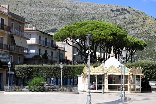 Free Sunny day at a quaint square in Fondi, Lazio, Italy with lush trees. Stock Photo
