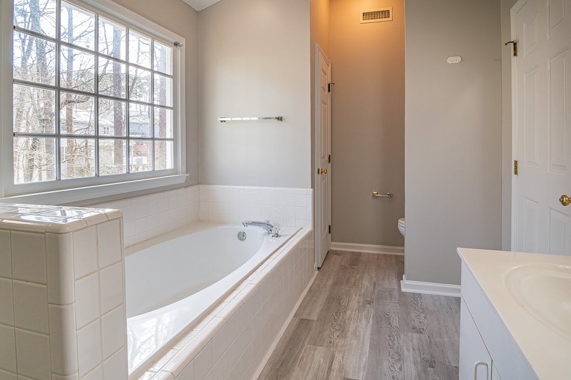 White Ceramic Sink Near White Bathtub