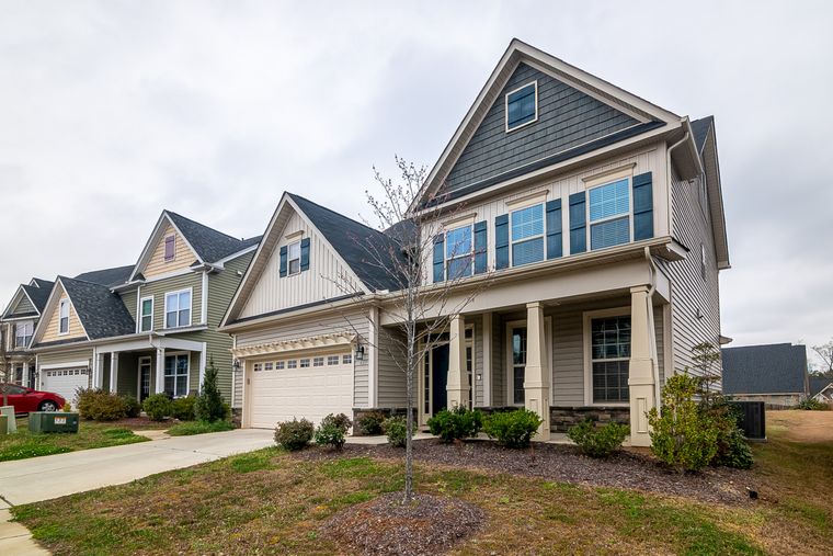 Row of newly built neighbourhood homes — photo by Curtis Adams on Pexels