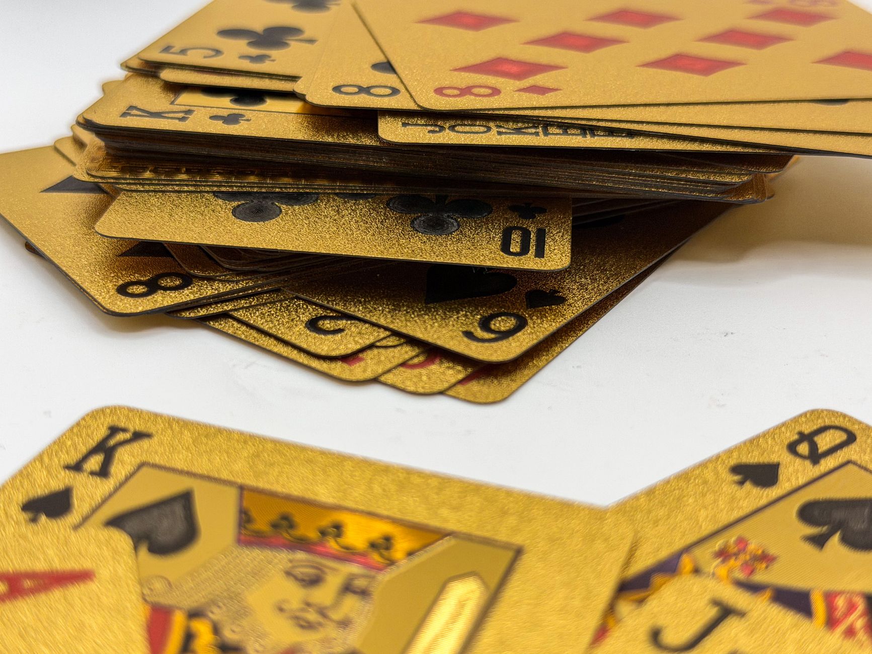 Teen Patti Gold game interface displayed on a smartphone beside playing cards and stacked virtual chips