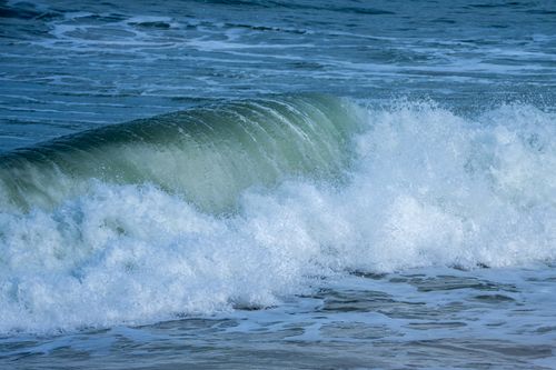 Free Powerful wave crashing on the shore of Valencia's Mediterranean coast. Stock Photo