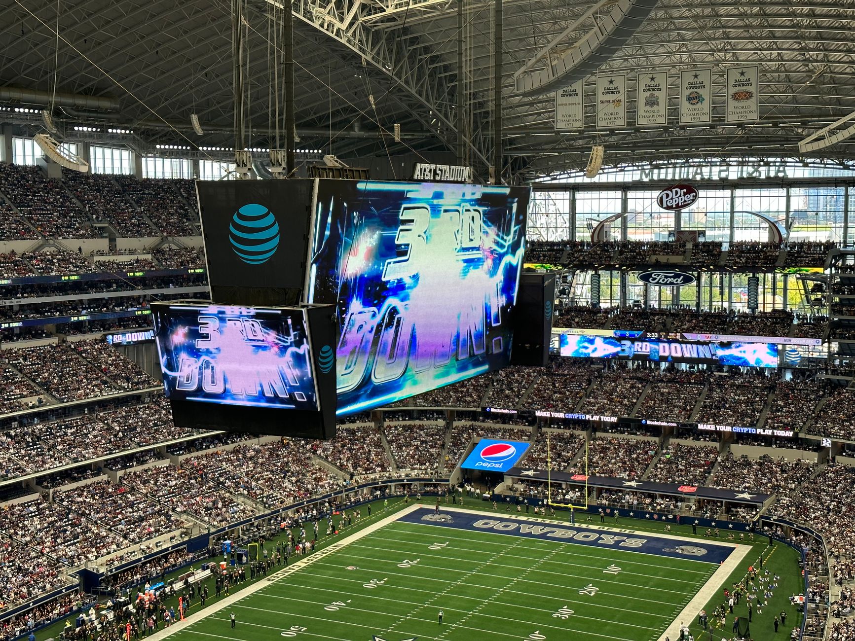 split-screen comparison showing an NFL kickoff, NCAA replay booth and FIFA World Cup match under stadium lights