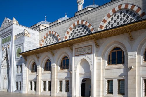 Free Beautiful exterior of a mosque in Istanbul showcasing Ottoman architecture under a clear blue sky. Stock Photo