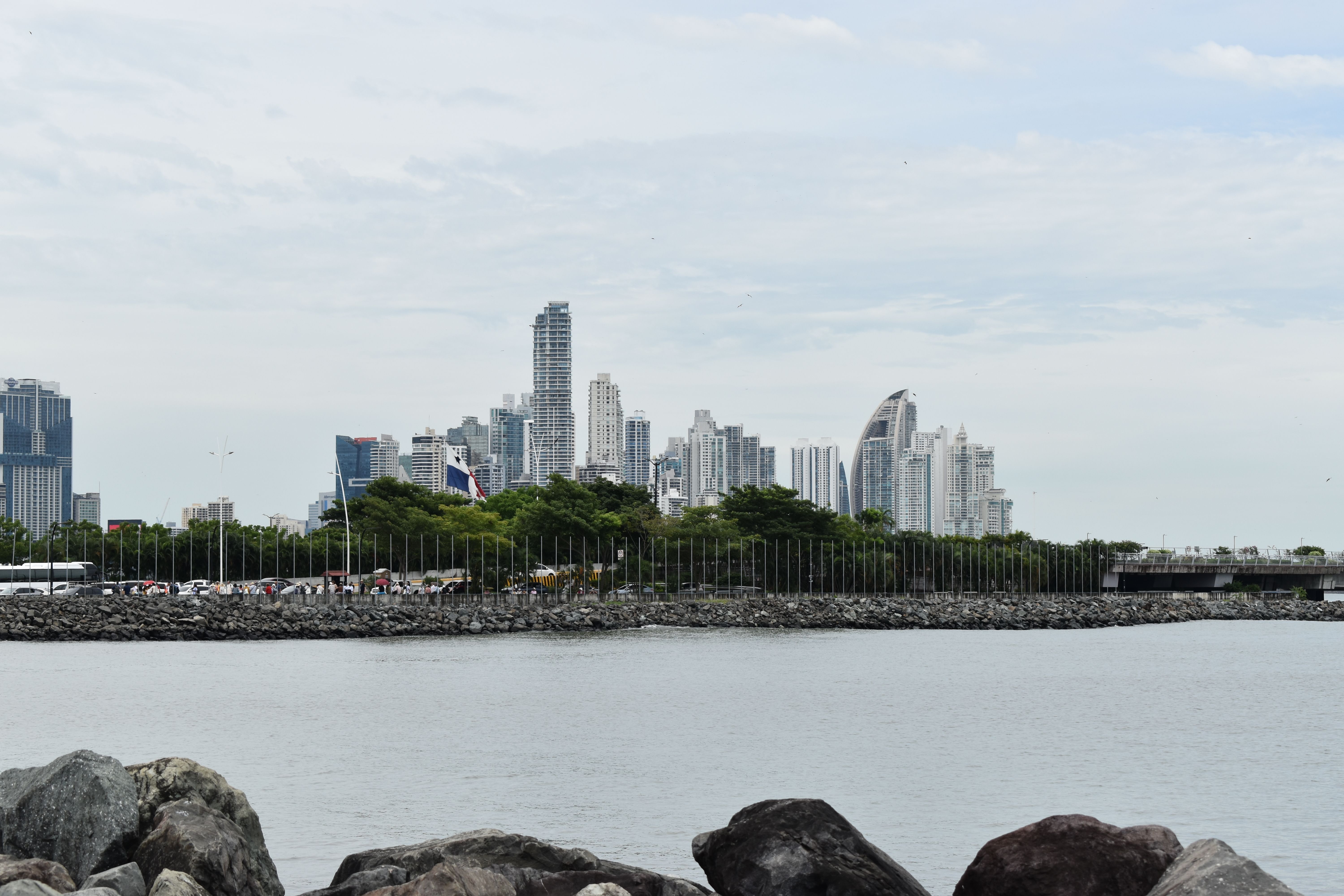 A scenic view of Panama City skyline captured from the waterfront, highlighting modern skyscrapers.
