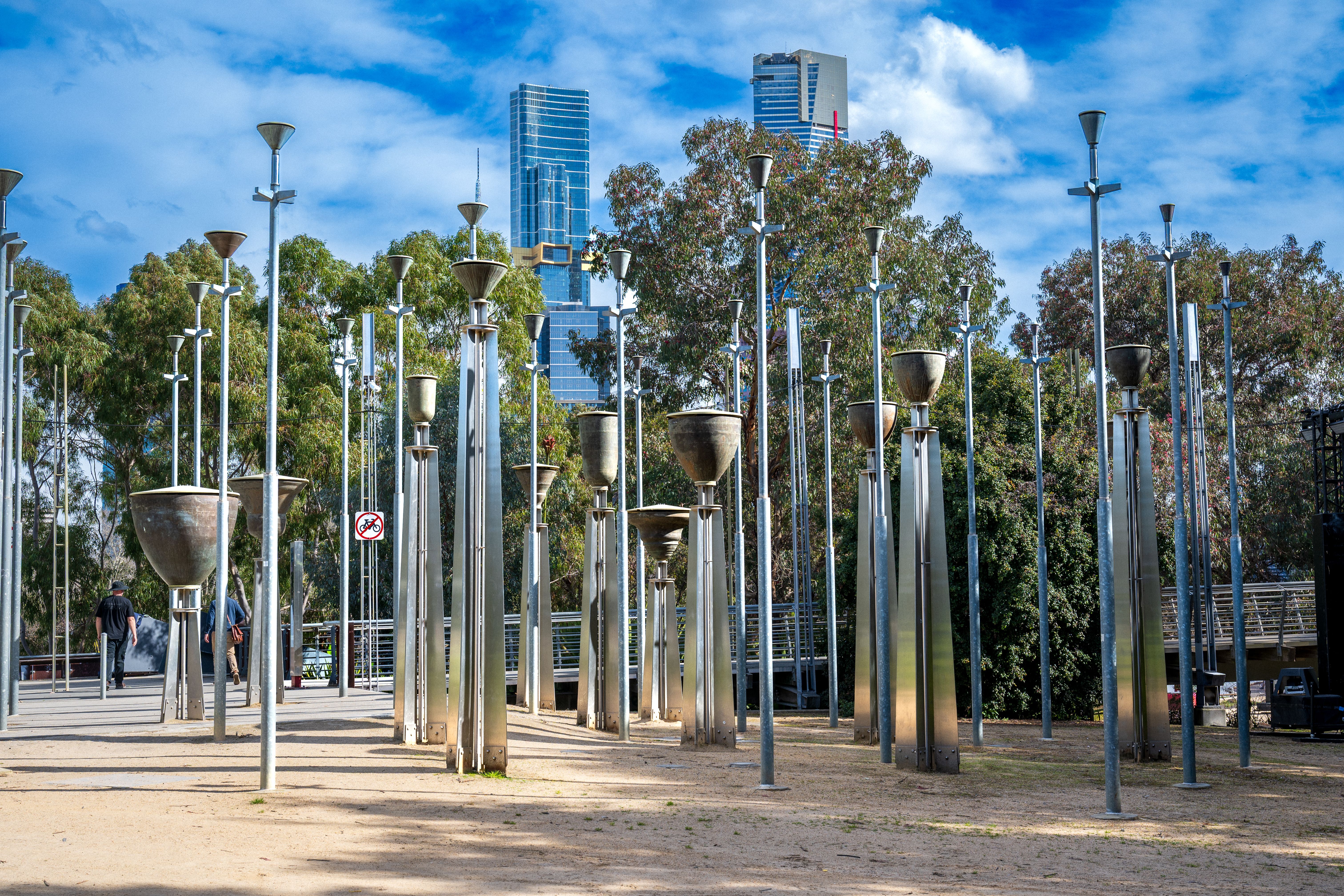 Artistic metal sculptures in Melbourne, set against a vibrant park backdrop, showcasing modern street art.