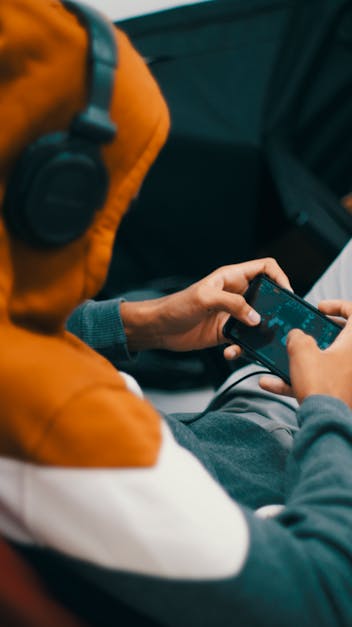 Person Playing Games On His Phone · Free Stock Photo