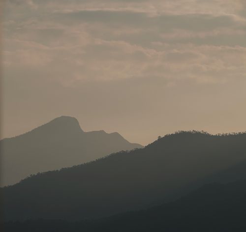Free Tranquil mountain silhouette at dusk in Hong Kong's New Territories, capturing peace and serenity. Stock Photo