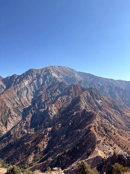 Free Breathtaking view of a mountain range with clear blue skies in Uzbekistan. Stock Photo