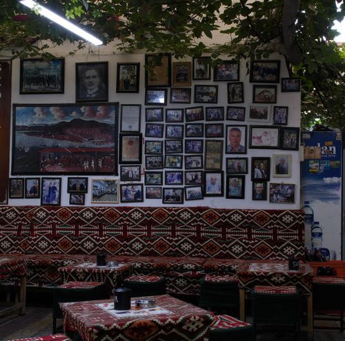 Free Traditional Turkish café with vibrant wall art and cultural decor in İzmir, Türkiye. Stock Photo