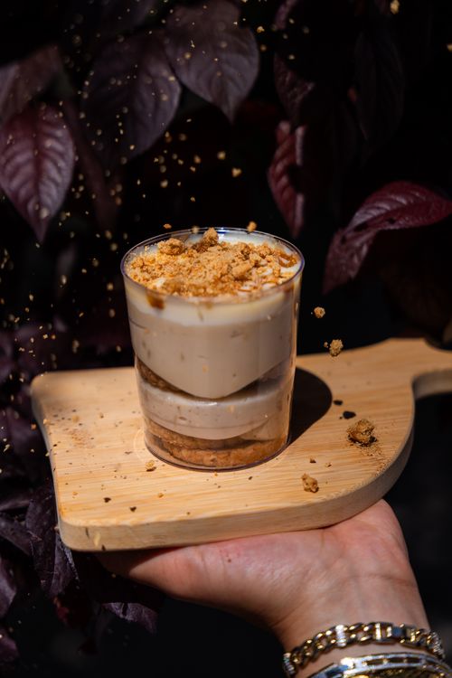 Free Creamy trilece dessert with crumbled topping served on a wooden tray, captured in Niğde, Türkiye. Stock Photo