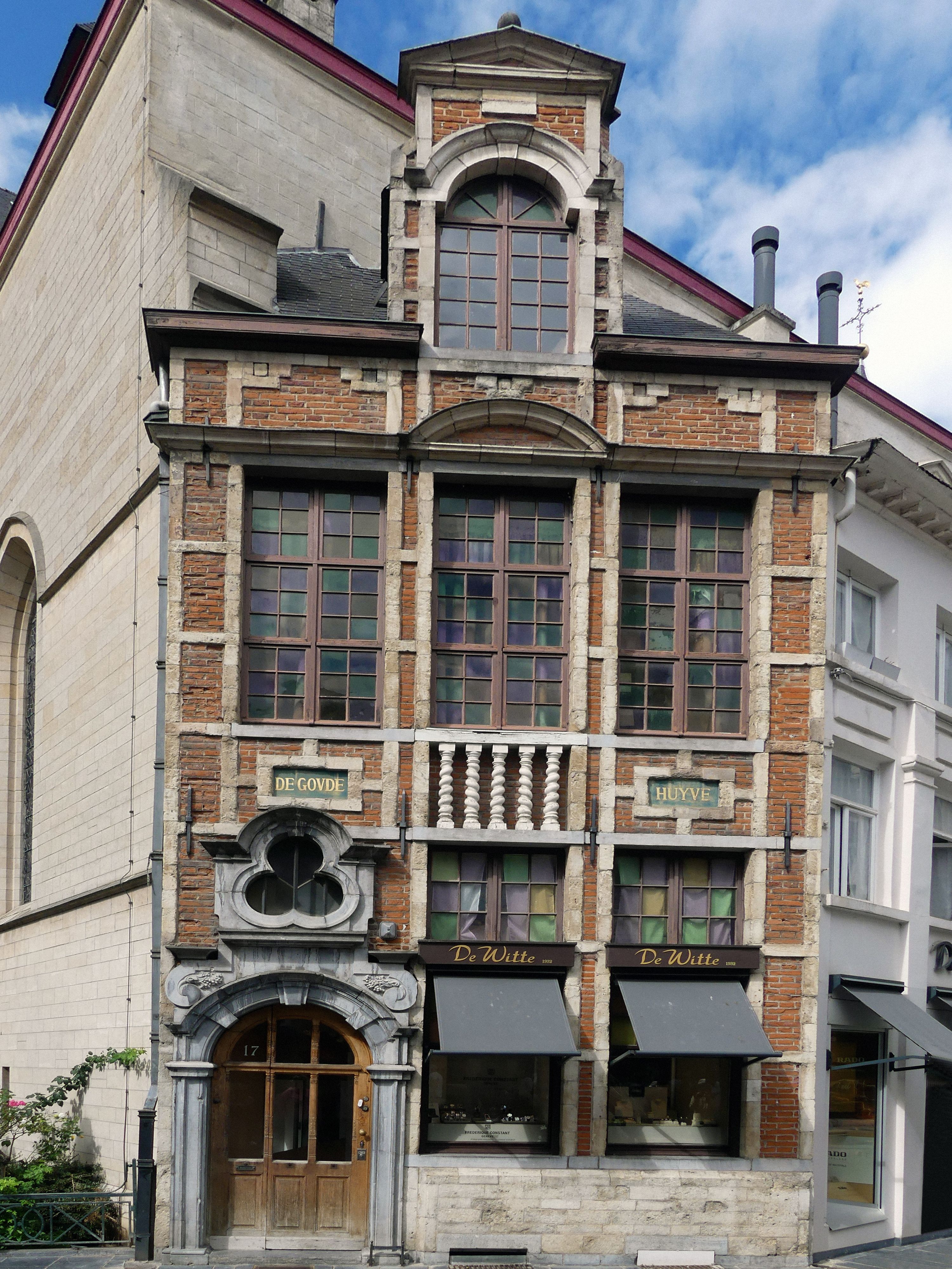 Classic Brussels brick architecture with ornate facade, showcasing historical European design.