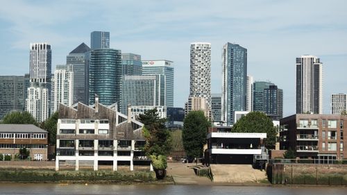 Free Vibrant daytime view of modern skyscrapers and historical buildings in London along the River Thames. Stock Photo