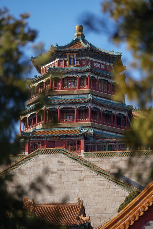 Free Stunning architectural detail of the Summer Palace pagoda surrounded by nature. Stock Photo