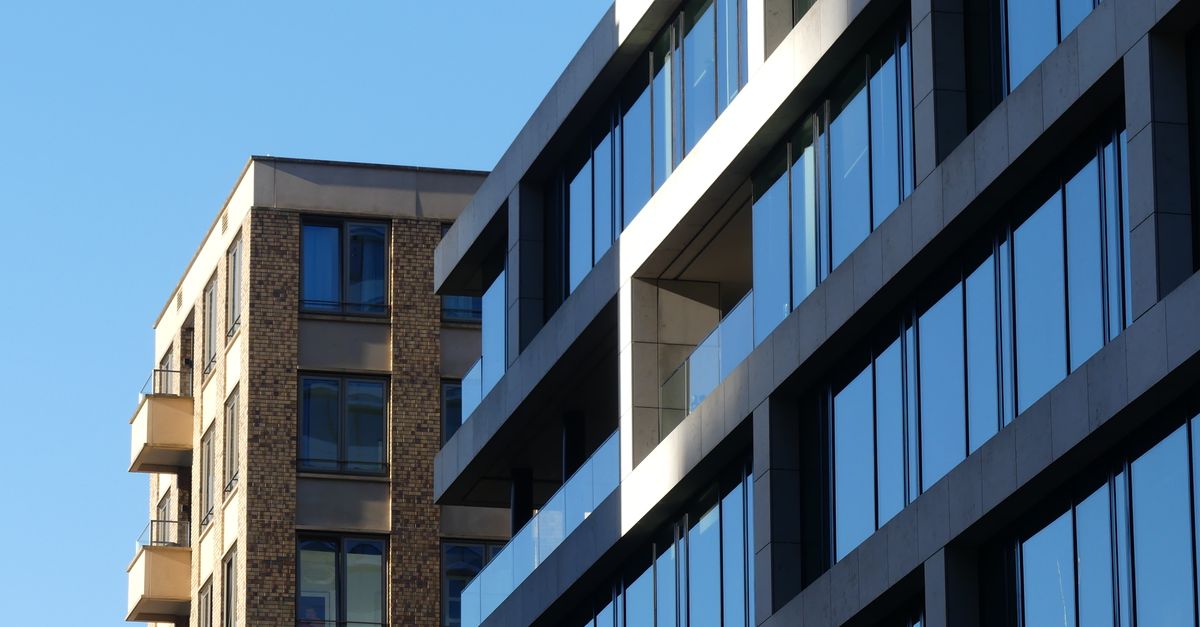 Contemporary urban buildings in Brussels showcasing modern architecture under clear blue skies.