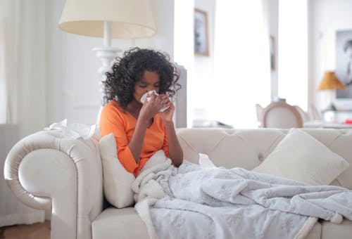 Woman Wiping Her Nose with Tissue