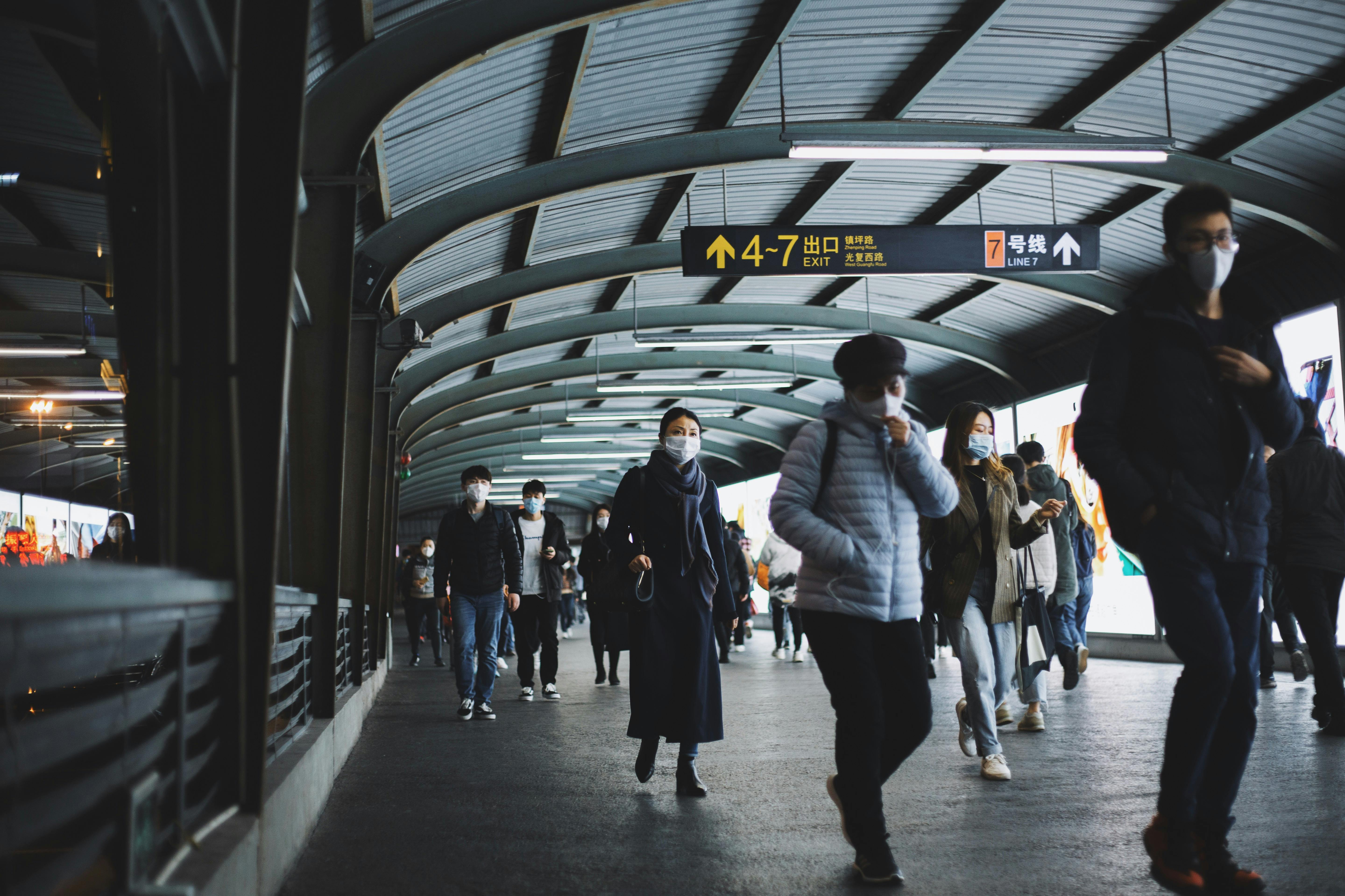 People Walking At A Train Station · Free Stock Photo
