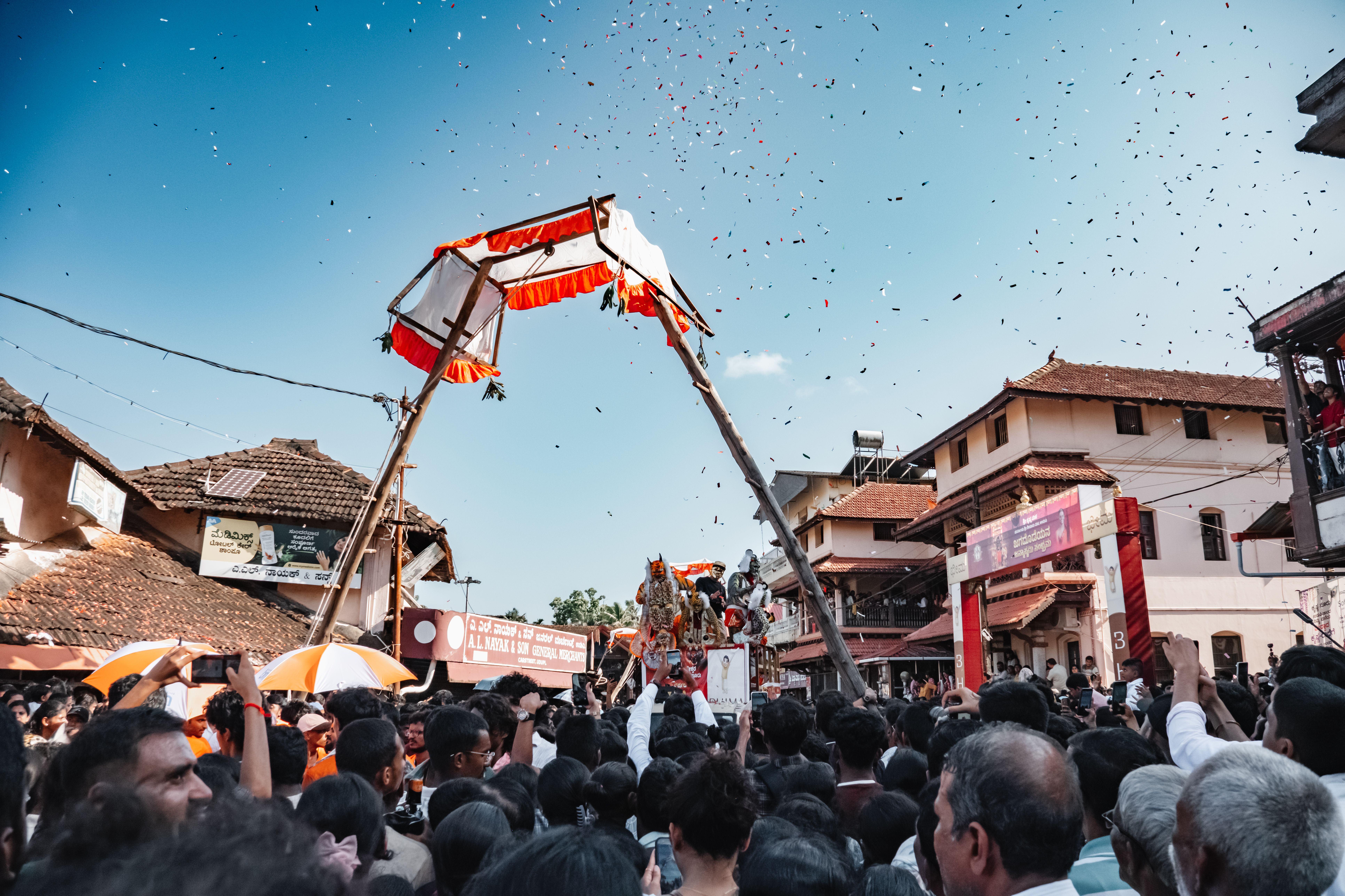 Crowd gathers for festive Pilivesha performance during Janmashtami in Udupi, Karnataka, India.