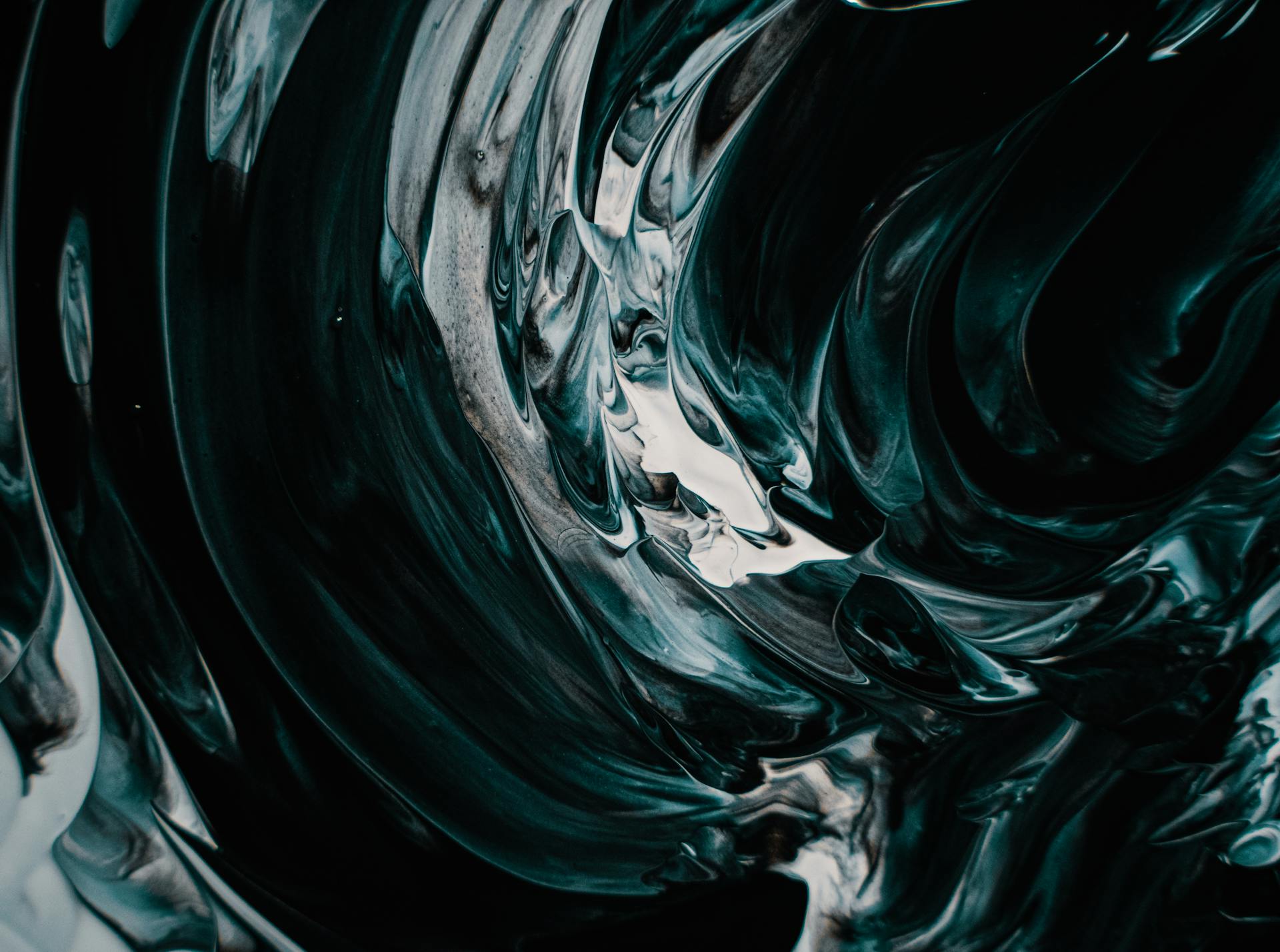 Stunning abstract image featuring swirling dark fluid designs in artistic expression.