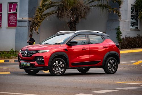 Free A vibrant red SUV captured in a bustling urban street in Malkerns, Eswatini, showcasing modern automotive design. Stock Photo